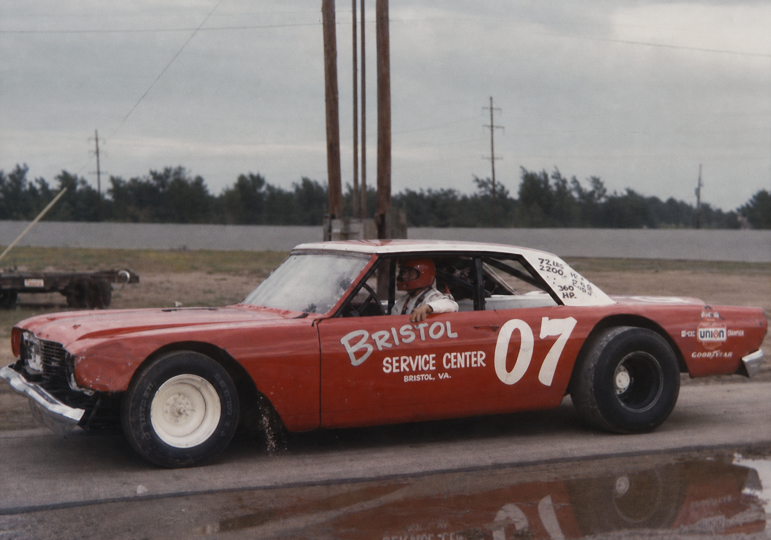 Ken in the red number 07 race car, likely at Illiana Motor Speedway